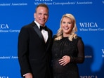White House press secretary Karoline Leavitt and her husband Nicholas Riccio, left, pose for photographers