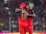 Royal Challengers Bengaluru's Virat Kohli and Bhuvneshwar Kumar celebrate a wicket during an Indian Premier League (IPL) 2026 match