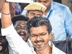 Vijay waves to supporters.