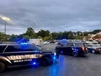 A DeKalb County police vehicle is seen at the site of the shooting outside Publix in Stonecrest, Georgia.