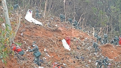 Rescuers search for the black boxes at a plane crash site in Tengxian county of Wuzhou, Guangxi Zhuang Autonomous Region in China on March 22, 2022. (File Photo/REUTERS)