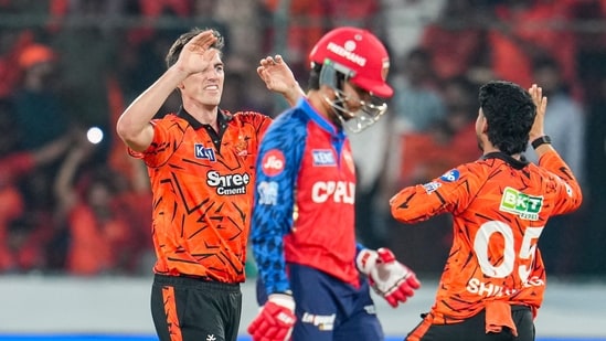Sunrisers Hyderabad's captain Pat Cummins, left, celebrates with a teammate after taking the wicket of Punjab Kings' Priyansh Arya during an IPL 2026 match (PTI)