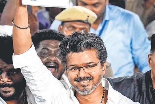 Vijay waves to supporters. (HT_PRINT)
