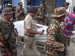 A visual of the local police security personnel with the dead body of Chandranath Rath.