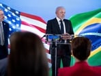 Luiz Inacio Lula da Silva, Brazil's president, right, speaks during a news conference at the Brazilian embassy in Washington, DC, US.
