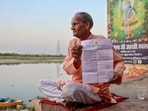 New Delhi: A resident shows a copy of the eviction notice served by the authorities, at Yamuna Bazar, Kashmere Gate area, in New Delhi, Thursday, May 7, 2026. 