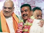 Union home minister Amit Shah congratulates BJP leader Suvendu Adhikari after he is elected as the leader of the West Bengal BJP Legislative Party on Friday. (ANI Video Grab)