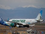 A Frontier Airlines jetliner waits for clearance to take off as high winds strafe Denver International Airport 