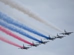 Russian Air Force Su-25 jets fly over Red Square leaving trails of smoke in the colors of the Russian state flag during the Victory Day military parade in Moscow. Russian Air Force Su-25 jets fly over Red Square leaving trails of smoke in the colors of the Russian state flag during the Victory Day military parade in Moscow.