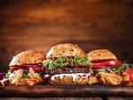 The proto-hamburger was anything but fast food. Modern capitalism transformed it into the poster-child of cravings. (Adobe Stock)