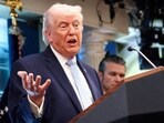 President Donald Trump, flanked by Secretary of Defense Pete Hegseth, speaks during a press conference