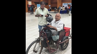 Ram Babu, a differently abled person comes to settle his traffic challan for not wearing helmet while driving at the National Lok Adalat at Gyan Bhawan in Patna on Saturday. (Santosh Kumar/HT)