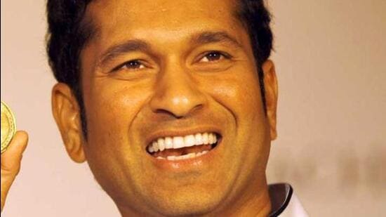 Cricket legend Sachin Tendulkar interacts with young fan on Tilak Road and advises him on road safety and helmet use. (FILE PIC)
