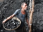 Mumbai, India - May 11, 2022: A labourer works at a coal wholesale market, amid increasing power outages due to its shortage owing to the spell of heat wave, in Mumbai, India, on Wednesday, May 11, 2022. (Photo by Bhushan Koyande/ HT Photo) (HT PHOTO)