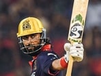 Royal Challengers Bengaluru's Krunal Pandya celebrates his half-century in the IPL match against Mumbai Indians at Raipur’s Shaheed Veer Narayan Singh International Stadium on Sunday. (ANI)