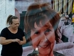 Frances Breay reacts as she visits a makeshift memorial for Nancy Guthrie in front of the KVOA television station on March 1.