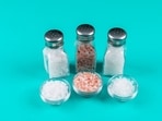 Often, salt shakers are on the table to add extra salt for taste, which is a bad habit!(Picture credit: Freepik )