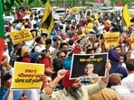 AAP and BJP workers engaged in a confrontation during a protest in Ludhiana on Sunday morning. (Gurpreet Singh/HT)