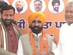 Gian Singh Mann being welcomed into the BJP by Haryana chief minister Nayab Singh Saini and Punjab unit chief Sunil Jakhar in Chandigarh on Monday. (HT Photo)