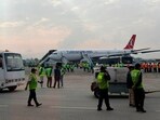 A Turkish Airlines aircraft is seen after passengers were safely evacuated and Nepal's main airport shut down, following a fire on the jet while landing in Kathmandu, Monday, May 11, 2026.