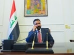 New Iraqi Prime Minister designate Ali al-Zaidi, uses a phone at his office in Baghdad.