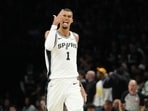 San Antonio Spurs forward Victor Wembanyama (1) celebrates making a three point shot against the Minnesota Timberwolves 