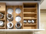 From stackable jars to under-shelf baskets, these kitchen organisers turn cramped cabinets and crowded counters into neat, practical spaces. (canva.com)