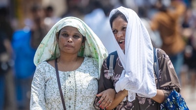 Girls protect themselves from the afternoon heat in Mumbai on Sunday. (Satish Bate/ HT Photo) Girls protect themselves from the afternoon heat in Mumbai on Sunday. (Satish Bate/ HT Photo)