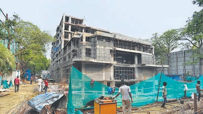 Green nets are set up at construction sites primarily to contain debris, reduce dust pollution, and protect workers and pedestrians from falling materials. (HT Archive)
