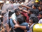 SFI activists scuffle with security personnel during a protest demanding cancellation of NEET-UG 2026 over the alleged paper leak and admission scam, in Thiruvananthapuram, Kerala