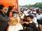 People having Prasad at the Bhandara organised for the second Bada Mangal in Lucknow on Tuesday (Deepak Gupta/HT)