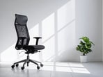 A supportive office chair keeps your spine happy, shoulders relaxed, and work hours surprisingly comfortable, even when deadlines refuse to take it easy. (canva.com)