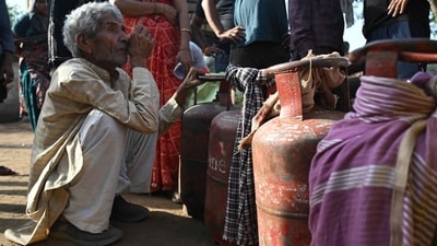 People wait with empty LPG cylinders for refilling in a village on the outskirts of Uttar Pradesh's Jewar district. (AFP) People wait with empty LPG cylinders for refilling in a village on the outskirts of Uttar Pradesh's Jewar district. (AFP)