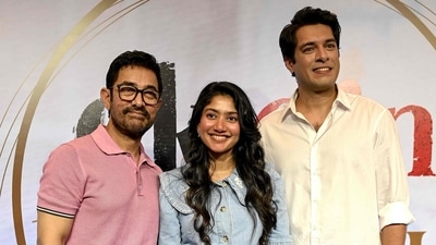 Actor and producer Aamir Khan, along with Sai Pallavi and Junaid Khan, attend an event promoting Ek Din. (Photo by Sujit JAISWAL / AFP) (AFP)