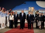 U.S. President Donald Trump walks with Chinese Vice President Han Zheng during an arrival ceremony at Beijing Capital International Airport, in Beijing, China, May 13, 2026. REUTERS/Evan Vucci     TPX IMAGES OF THE DAY