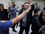 Senate security personnel and police officers ask members of the media to stay back after gunshots were heard at the Philippine Senate, as chaos mounted in anticipation of an attempt to arrest a top senator wanted by the International Criminal Court, in Pasay City, Metro Manila, Philippines.