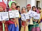 School children take part in an awareness campaign to stop child marriage on 'Akshaya Tritiya' in Bikaner, Rajasthan. (PTI)