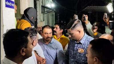 Nashik [Maharashtra], May 12 (ANI): The accused, Shubham Khairnar, being taken into custody by the CBI officials from the Crime Branch Unit-2 office in connection with the alleged NEET-UG 2026 paper leak, in Nashik on Tuesday. (ANI Video Grab) (ANI Video Grab)