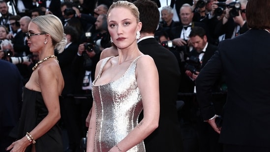 Maika Monroe stunned in a shimmering silver sequin gown by Ashi Studio, paired with dazzling jewellery from Pasquale Bruni.(AFP)