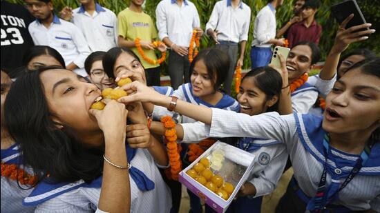 Students of Lucknow Public School celebrate after results were declared on Wednesday. (HT Photo)