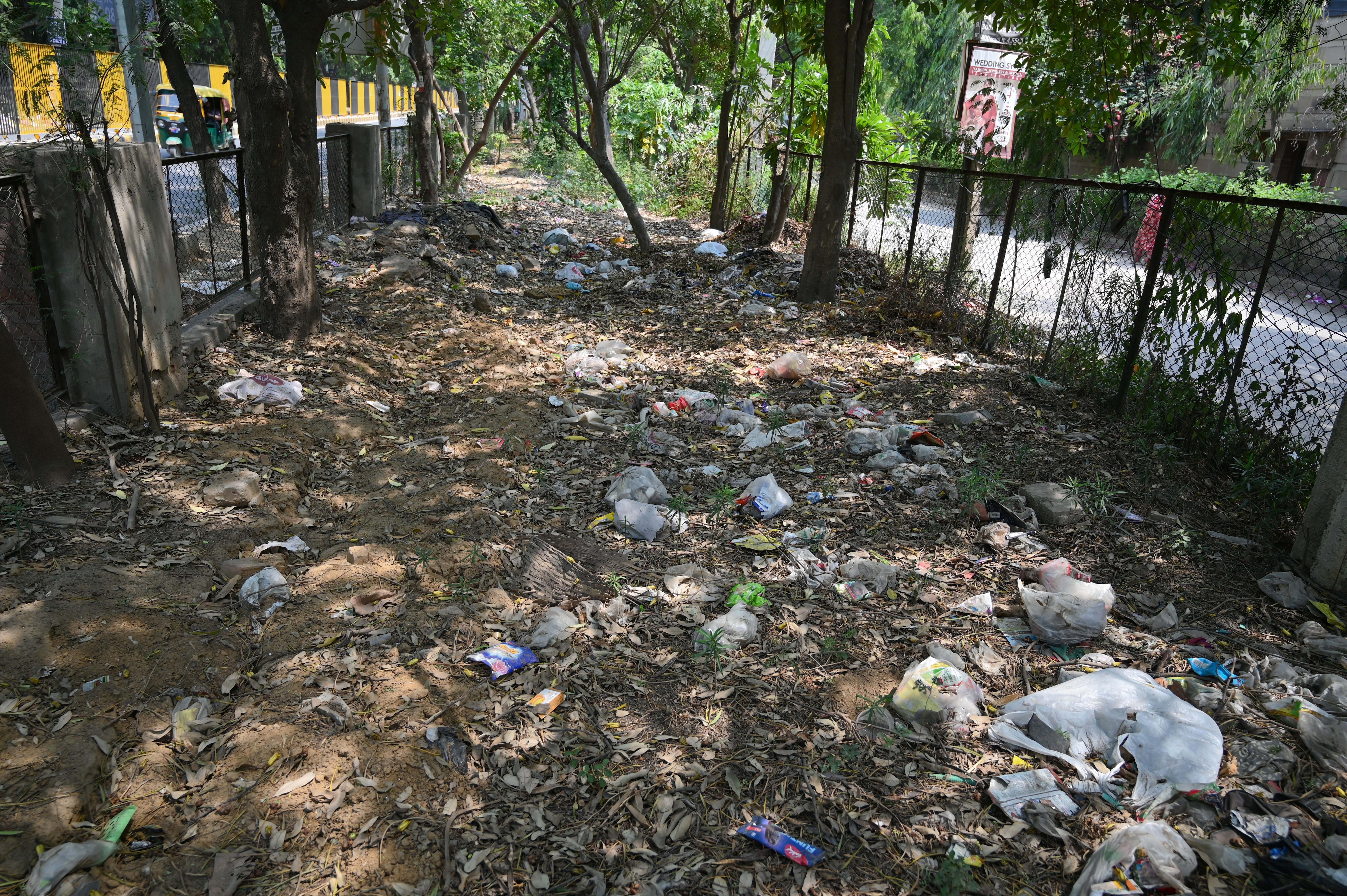 Residents said irregular garbage collection and poor road sweeping have worsened sanitation conditions across the sector ahead of monsoon. (Parveen Kumar/HT) Residents said irregular garbage collection and poor road sweeping have worsened sanitation conditions across the sector ahead of monsoon. (Parveen Kumar/HT)
