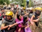 Police detained Students’ Federation of India (SFI) members during a protest over the cancellation of the NEET-UG 2026 exam following allegations of paper leak and examination irregularities, in Kottayam on Wednesday.