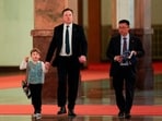 Tesla CEO Elon Musk and his son X Æ A-Xii walk on as Chinese Premier Li Qiang meets with American CEOs, in Beijing, China, May 14, 2026. 