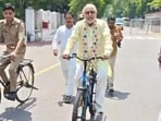 Finance minister Suresh Khanna on his way to office on a bicycle. (Sourced)