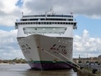 The British cruise ship Ambition is pictured, as French authorities have ordered 1,700 passengers and crew to stay on board due to a gastrointestinal illness outbreak, in Bordeaux, southwestern France, Wednesday, May 13, 2026. (AP Photo/Caroline Blumberg)