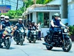 Maharashtra Chief Minister Devendra Fadnavis rides a two-wheeler, in view of Prime Minister Narendra Modi's appeal for saving fuel, in Mumbai.