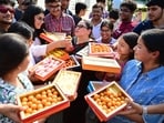 Students of KBDAV School, Sector 7, Chandigarh, offering sweets to the principal after the results were declared on Wednesday. (Ravi Kumar/HT)