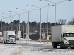 Trucks drive towards the Canada-US border in Saint-Bernard-de-Lacolle, Quebec, Canada (Photograph for representative purpose only). (Bloomberg) Trucks drive towards the Canada-US border in Saint-Bernard-de-Lacolle, Quebec, Canada (Photograph for representative purpose only). (Bloomberg)