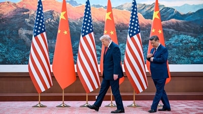US President Donald Trump (left) with China's Xi Jinping in Beijing on Thursday. (Reuters)