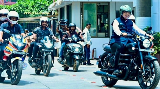 Maharashtra Chief Minister Devendra Fadnavis rides a two-wheeler, in view of Prime Minister Narendra Modi's appeal for saving fuel, in Mumbai. (@Dev_Fadnavis)